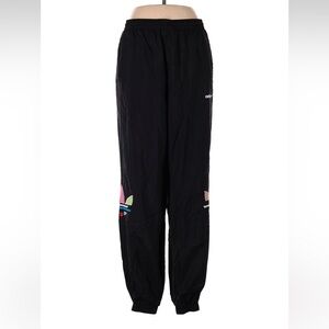 Black Adidas high-waisted pants with multi color logo and side pockets